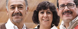 Tres profesores sonriendo